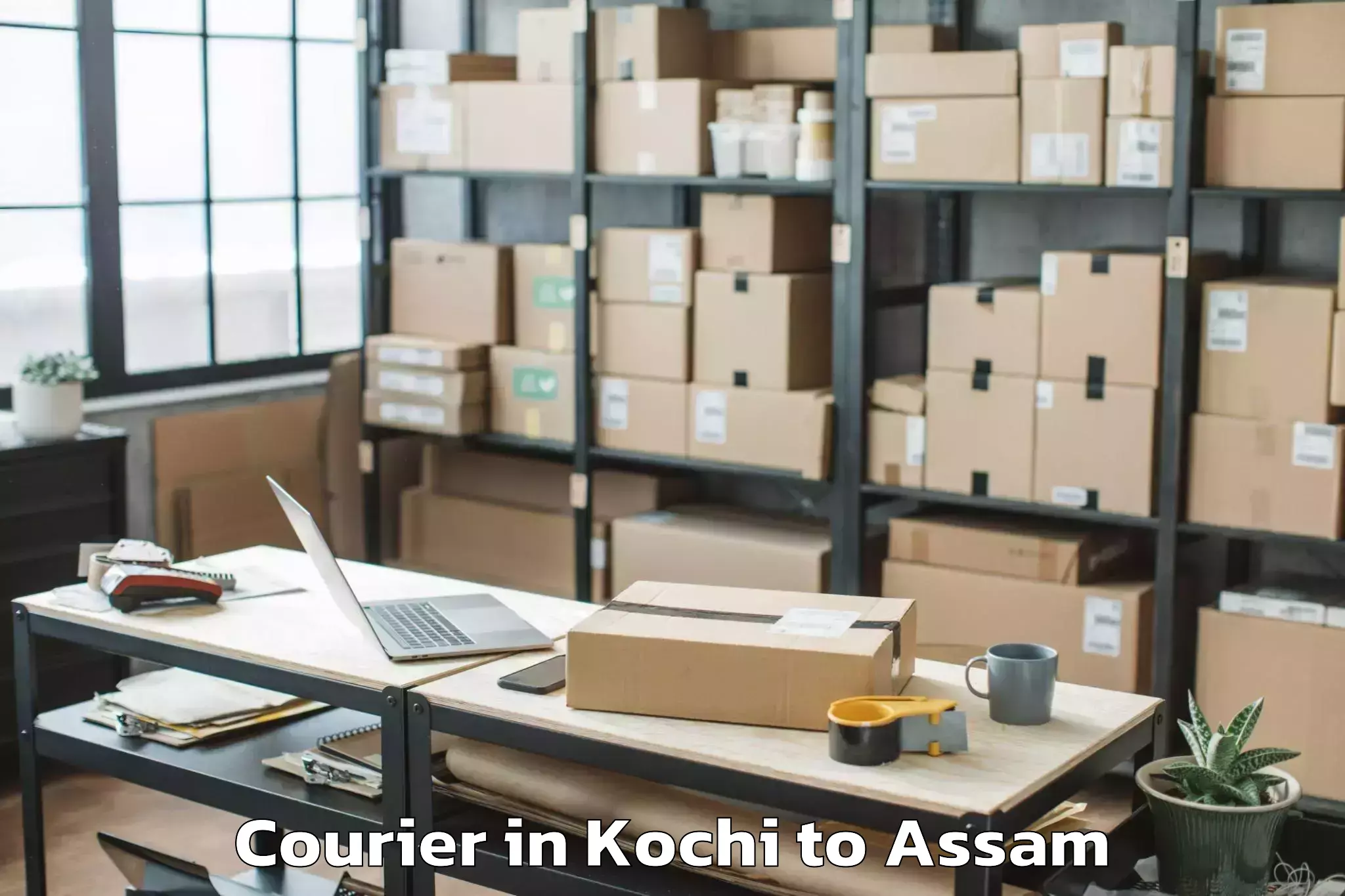 Book Kochi to Dhakuakhana Courier